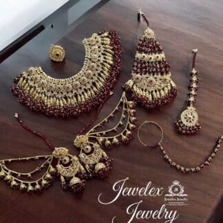 intricate antique gold artistry paired with timeless burgundy beads necklace set