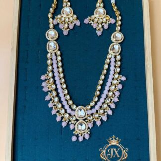 the jewelex multi-layered kundan polki necklace set in four different bead accents